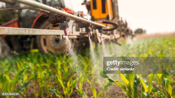 crop sprayer - tractor stock pictures, royalty-free photos & images