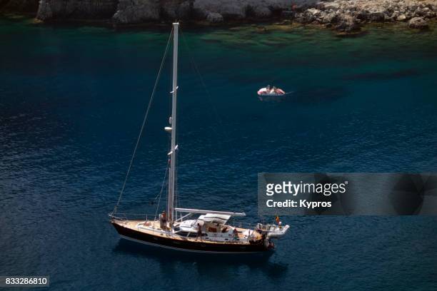 europe, greece (2017), rhodes island, anthony quinn beach, view of yacht moored in bay - anthony quinn bay stock pictures, royalty-free photos & images