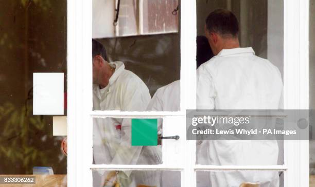 Health and Safety workers in white suits at the Institute for Animal Health Laboratory in Pirbright, as they investigate the foot and mouth disease...