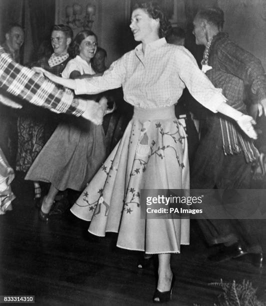 Princess Elizabeth square dances at Government House, at a party given by Viscount and Lady Alexander.