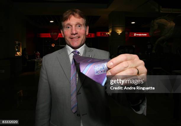 Cyril Leeder of the Ottawa Senators shows off his lavender Hockey Fights Cancer tie prior to a game against the Phoenix Coyotes at Scotiabank Place...