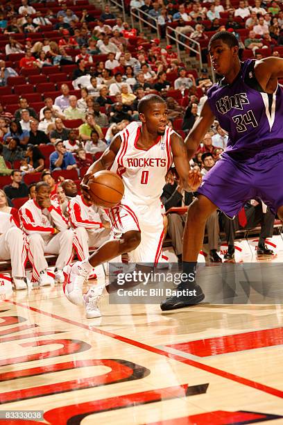 Aaron Brooks of the Houston Rockets drives the ball past Jason Thompson of the Sacramento Kings on October 17, 2008 at the Toyota Center in Houston,...