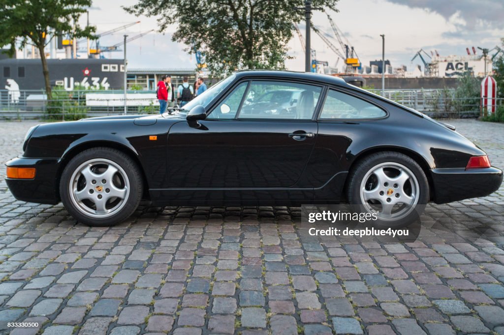 Parked black Porsche 911 Carrera during the event with Magnus Walker on the Fish Market Hamburg