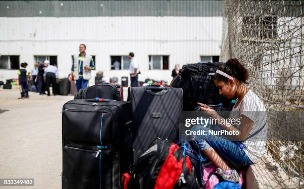 Palestinian girl waits to cross the Rafah Border crossing , in Rafah in the southern Gaza Strip, on August 16, 2017.