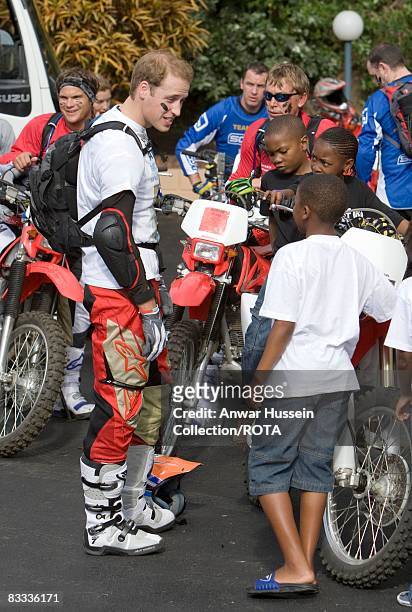Prince William chats to local children as he prepares to set off at the start of the Enduro 2008 Motorcycle Rally to benefit UNICEF, the Nelson...