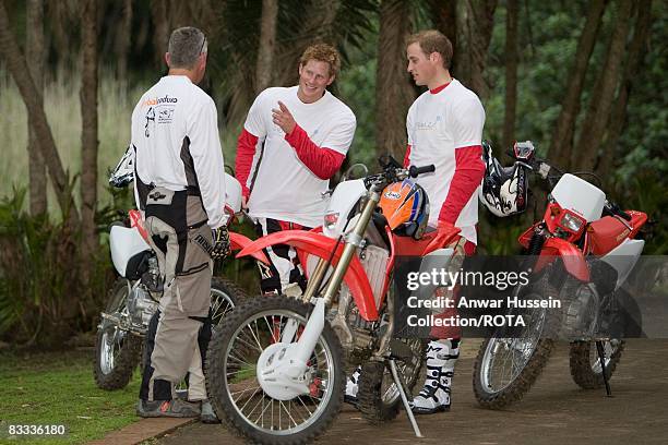 Prince William and Prince Harry chat to team leader Mike Glover at a practice session for the Enduro 2008 Motorcycle Rally to benefit UNICEF, the...