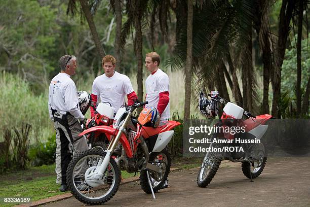 Prince William and Prince Harry chat to team leader Mike Glover at a practice session for the Enduro 2008 Motorcycle Rally to benefit UNICEF, the...