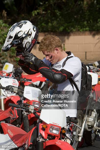Prince Harry puts on his helmet at the start of the Enduro 2008 Motorcycle Rally to benefit UNICEF, the Nelson Mandela Children's Fund and Sentebale,...