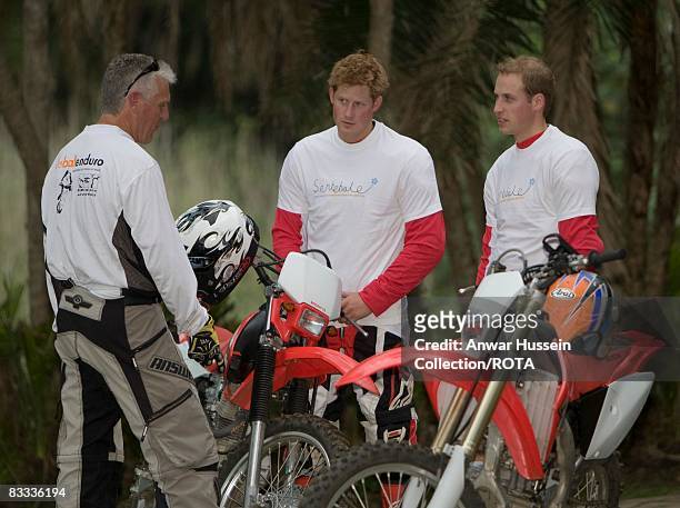 Prince William and Prince Harry chat to team leader Mike Glover at a practice session for the Enduro 2008 Motorcycle Rally to benefit UNICEF, the...