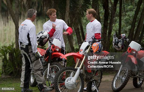 Prince William and Prince Harry chat to team leader Mike Glover at a practice session for the Enduro 2008 Motorcycle Rally to benefit UNICEF, the...