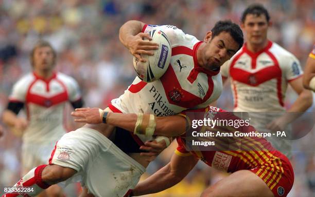 St Helen's Mike Bennett loses his shorts in a tackle from Catalan's Clint Greenshields during the Carnegie Challenge Cup Final at Wembley Stadium,...