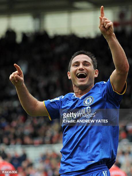 Chelsea's English midfielder Frank Lampard celebrates after scoring the fourth goal during the English Premier league football match against...