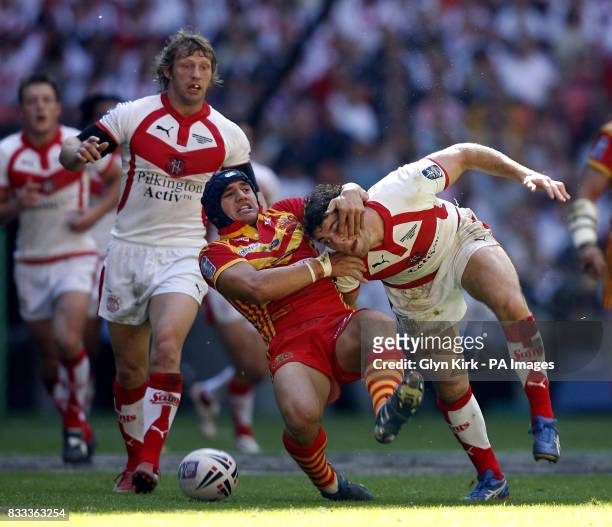 Catalans Dragons Kane Bentley tackles St Helens Paul Wellens during the Carnegie Challenge Cup Final at Wembley Stadium, London.