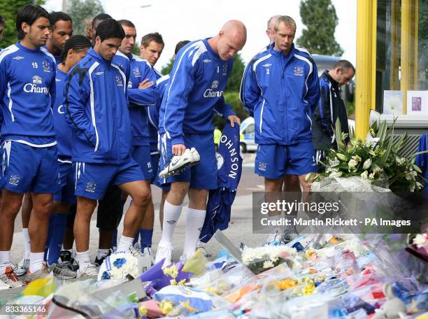 Everton striker Andrew Johnson lays down a shirt and some boots in tribute to Rhys Jones.