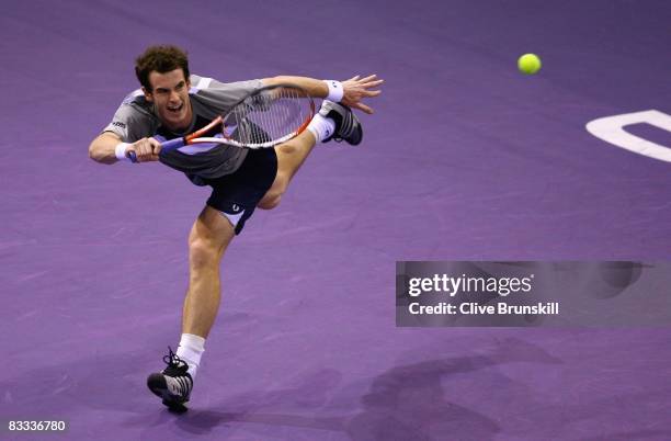 Andy Murray of Great Britain in action against Roger Federer of Switzerland during their semi final match at the Madrid Masters tennis tournament at...