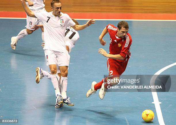 Italy's futsal player Marcio Forte vies for the ball with Russia's Vladislav Shayakhmetov on October 18, 2008 during their 3rd place FIFA Futsal...