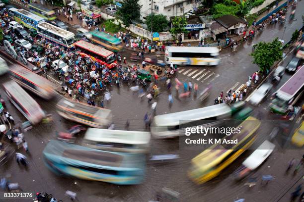 Rickshaw puller and vehicle stuck in a traffic signal at paltan. In the last 10 years, the average traffic speed in Dhaka has dropped from 21 km/hour...