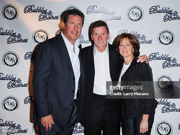 Former Miami Dolphin quaterback Dan Marino poses with Footy and his wife Claire at the 8th Annual Bubbles and Bows Gala benefitting Here's Help at...