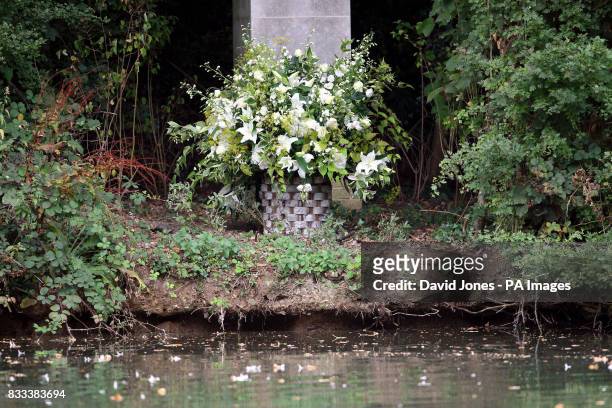 Flowers are left at a tribute laid by the Spencer family is seen at Althorp House, Northampton, in memory of Diana, Princess of Wales, on the island...