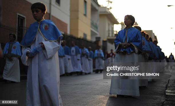 Peninents walk in procession in the streets of Pompei on October 18, 2008 on the eve of the visit by Pope Benedict XVI. The Pope will celebrate a...