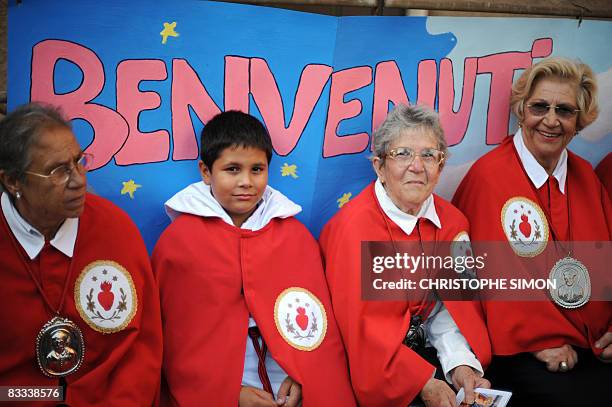 Penitents wait for the start of a procession in the streets of Pompei on October 18 on the eve of the visit by Pope Benedict XVI. The Pope will...