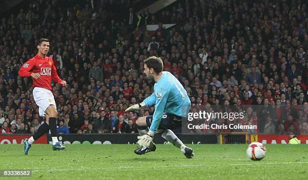 Cristiano Ronaldo of Manchester United scores their second goal during the Barclays Premier League match between Manchester United and West Bromwich...