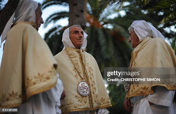 Penitents wait for the start of a procession in the streets of Pompei on October 18 on the eve of the visit by Pope Benedict XVI. The Pope will...