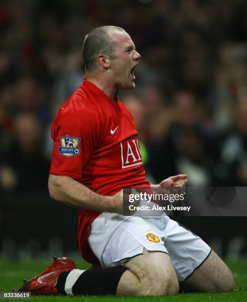 Wayne Rooney of Manchester United celebrates as he scores their first goal during the Barclays Premier League match between Manchester United and...