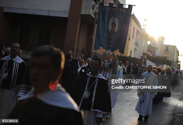 Penitents walk in procession in the streets of Pompei on October 18 on the eve of the visit by Pope Benedict XVI. The Pope will celebrate a mass at...
