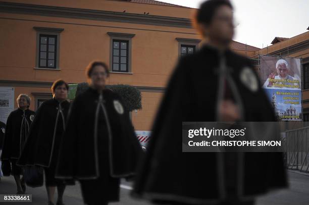 Penitents walk in procession in the streets of Pompei on October 18 on the eve of the visit by Pope Benedict XVI. The Pope will celebrate a mass at...