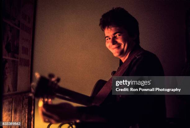 John Prine tunes-up backstage at The Telagi music club in October 1972 in Boulder, Colorado