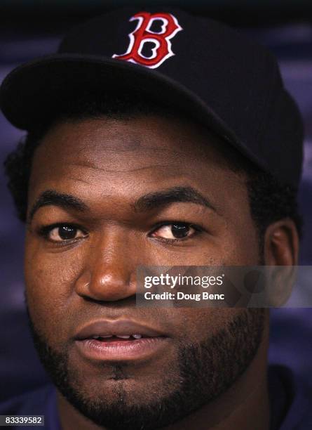 David Ortiz of the Boston Red Sox looks on from the dugout before game six of the American League Championship Series against the Tampa Bay Rays...