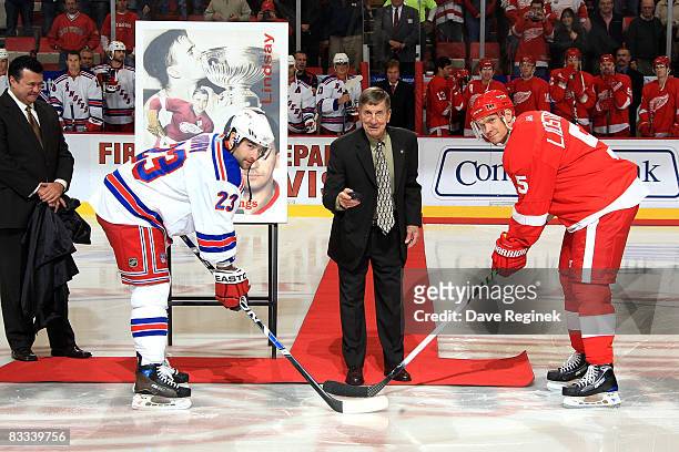 Hall of famer Ted Lindsay drops the first puck between captains Chris Drury of the New York Rangers and Nicklas Lidstrom of the Detroit Red Wings...