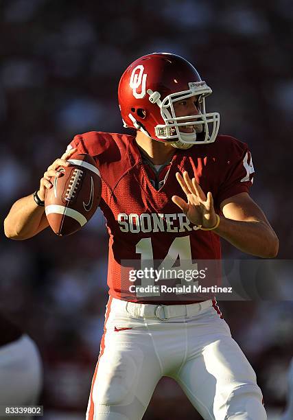 Quarterback Sam Bradford of the Oklahoma Sooners drops back to pass against the Kansas Jayhawks at Memorial Stadium on October 18, 2008 in Norman,...