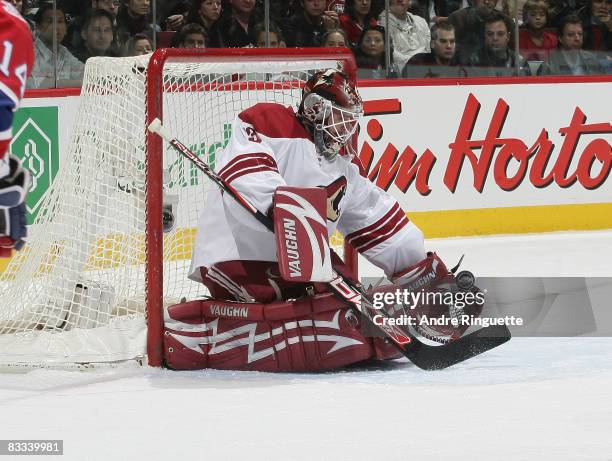 Ilya Bryzgalov of the Phoenix Coyotes makes a glove save against the Montreal Canadiens in first period action at the Bell Centre on October 18, 2008...