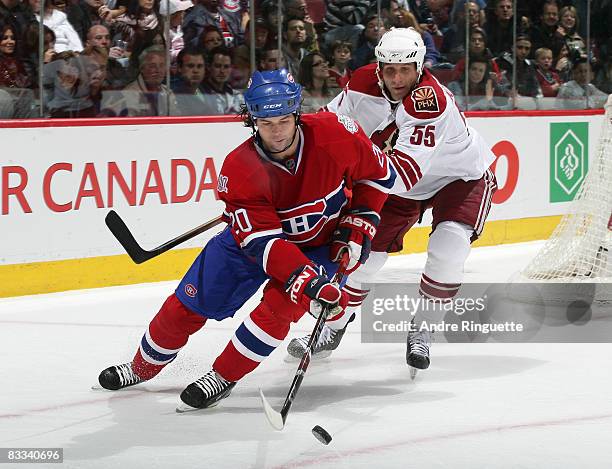 Robert Lang of the Montreal Canadiens stickhandles the puck against Ed Jovanovski of the Phoenix Coyotes at the Bell Centre on October 18, 2008 in...