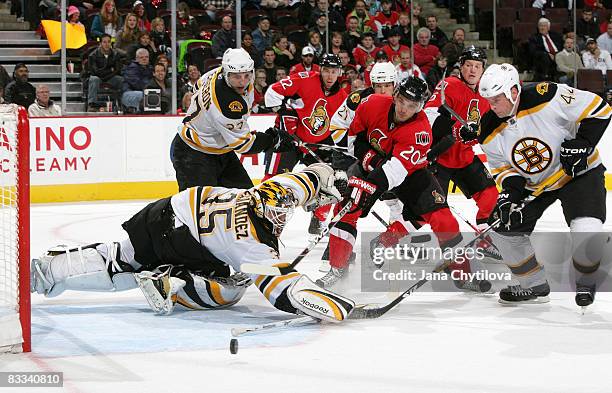 Antoine Vermette of the Ottawa Senators reaches for the loose puck after Manny Fernandez of the Boston Bruins makes a save at Scotiabank Place on...