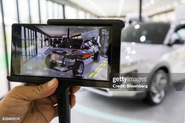 Hyundai Motor Co. Next generation fuel-cell electric sport utility vehicle powertrain system is seen on an augmented reality monitor during an...