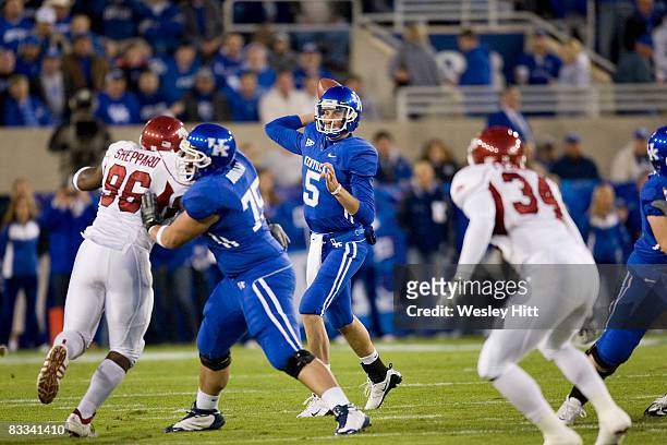 Mike Hartline of the Kentucky Wildcats throws a pass against the Arkansas Razorbacks at Commonwealth Stadium on October 18, 2008 in Lexington,...