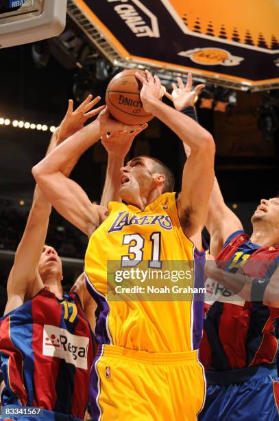 Chris Mihm of the Los Angeles Lakers has his shot challenged during the game against Regal FC Barcelona at Staples Center on October 18, 2008 in Los...