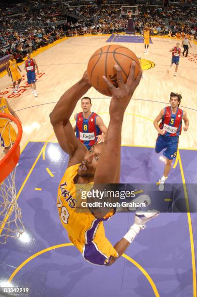 Mbenga of the Los Angeles Lakers goes up for a dunk during the game against Regal FC Barcelona at Staples Center on October 18, 2008 in Los Angeles,...