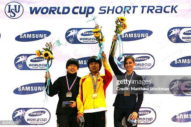 Sae-Bom Shin of South Korea, Meng Wang of China and Kimberly Derrick on the medals podium after the 1000 meter final during the Samsung ISU World Cup...