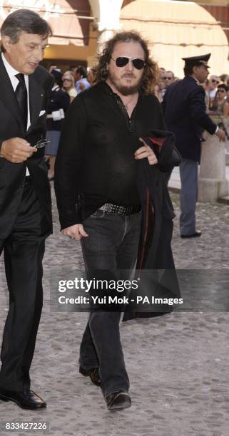 Singer Zucchero arrives outside the 12th century cathedral Duomo Di Modena in Italy, where the funeral of Luciano Pavarotti is taking place today.