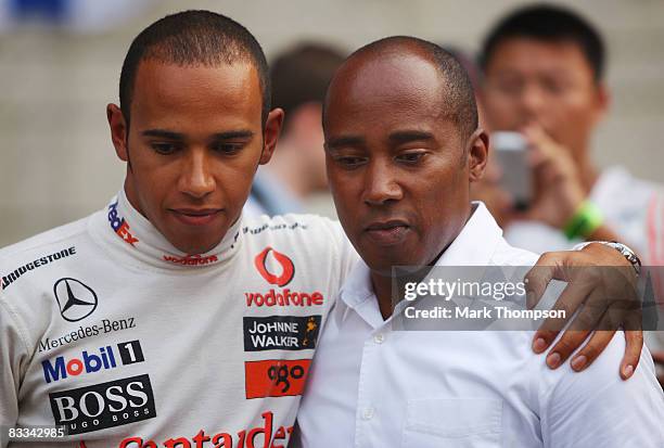 Lewis Hamilton of Great Britain and McLaren Mercedes is seen with his father Anthony Hamilton on the grid before the start of the Chinese Formula One...