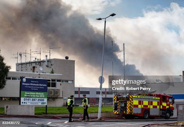 Firefighters attend the scene of a blaze at Blochairn Fruitmarket on August 17, 2017 in Glasgow. The Scottish Fire and Rescue Service are tackling a...