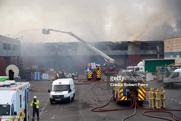 Firefighters attend the scene of a blaze at Blochairn Fruitmarket on August 17, 2017 in Glasgow. The Scottish Fire and Rescue Service are tackling a...
