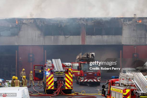 Firefighters attend the scene of a blaze at Blochairn Fruitmarket on August 17, 2017 in Glasgow. The Scottish Fire and Rescue Service are tackling a...