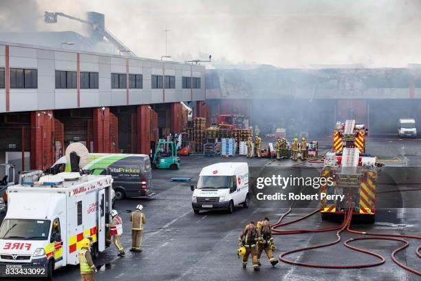 Firefighters attend the scene of a blaze at Blochairn Fruitmarket on August 17, 2017 in Glasgow. The Scottish Fire and Rescue Service are tackling a...