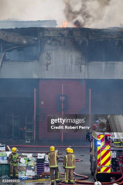 Firefighters attend the scene of a blaze at Blochairn Fruitmarket on August 17, 2017 in Glasgow. The Scottish Fire and Rescue Service are tackling a...