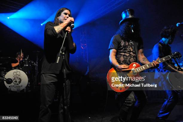 Heavy metal legend Ozzy Osbourne and Velvet Revolver guitarist Slash perform with all-star cover band Camp Freddy at the benefit grand opening of...